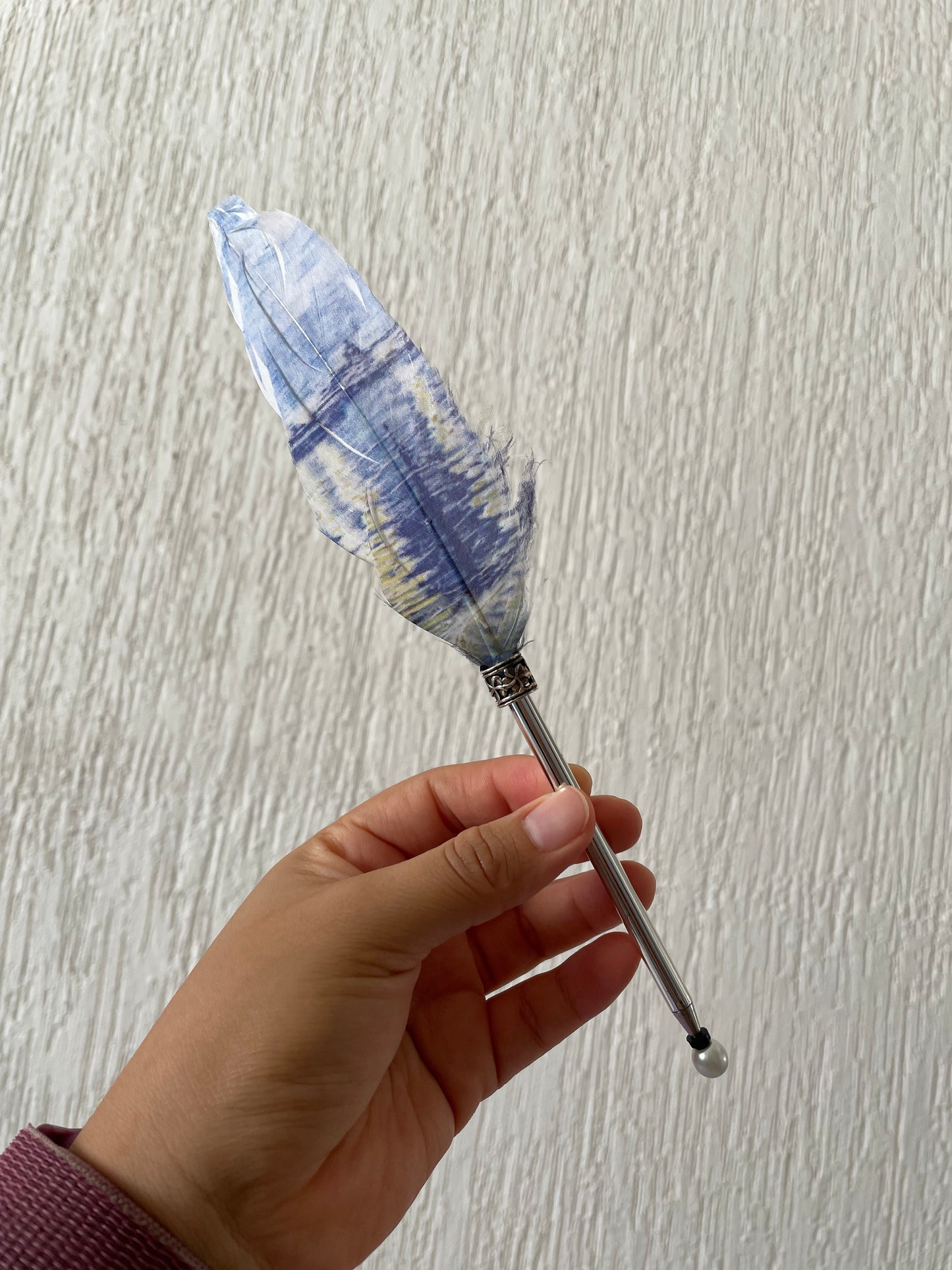St. E. Pluma con pluma
